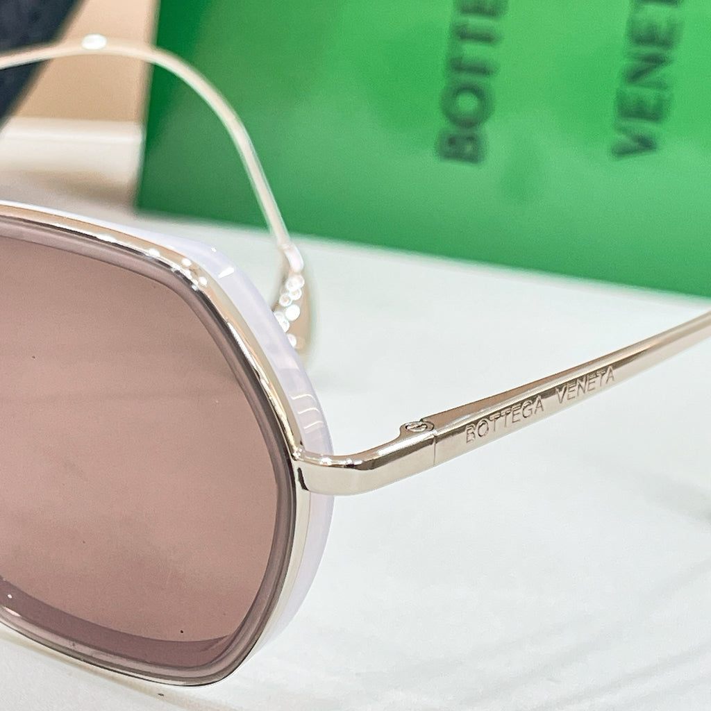 Sunglasses temple with Bottega Veneta engraving, close-up