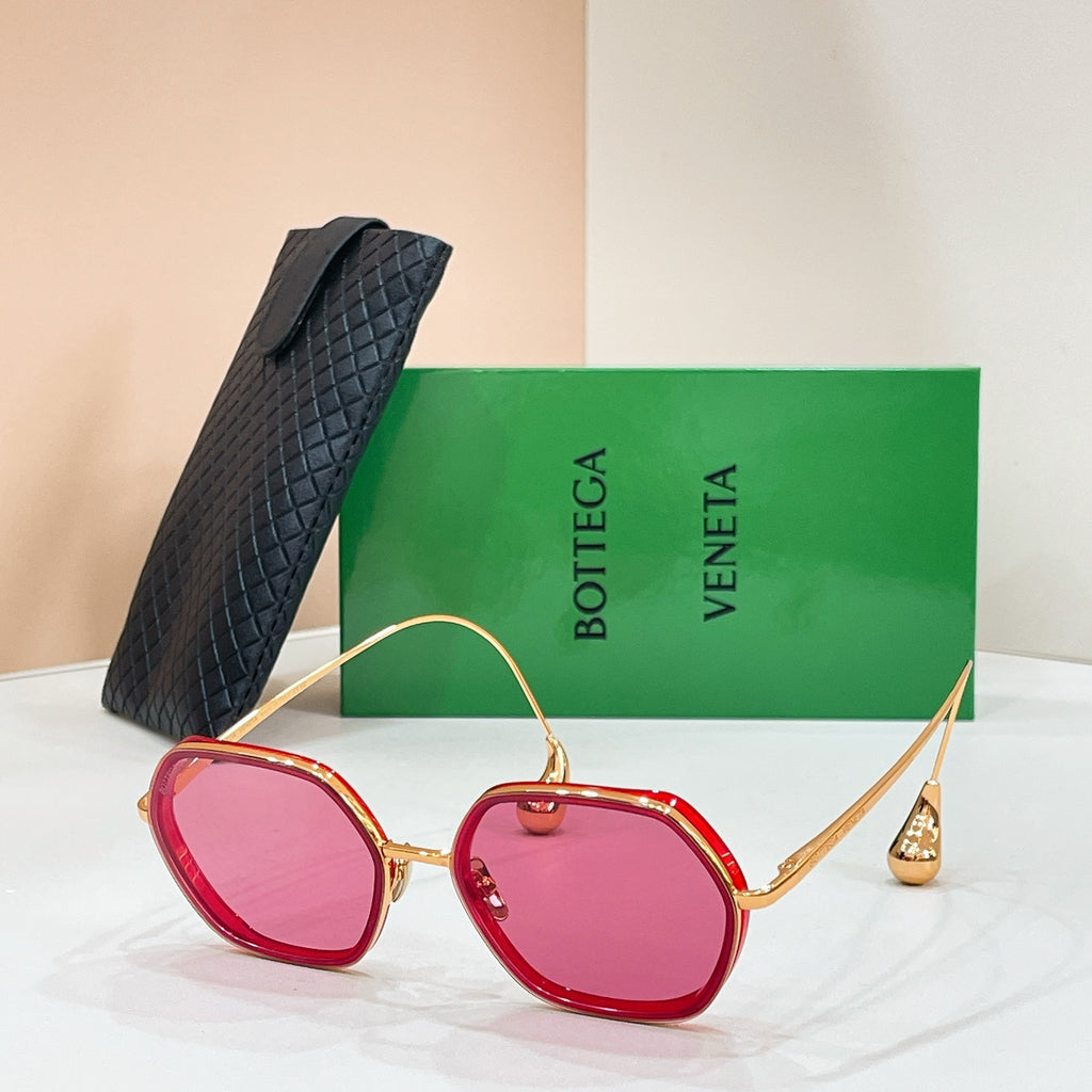 Bottega Veneta sunglasses with gold-tone frame and pink-tinted lenses