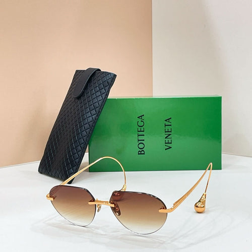 Bottega Veneta aviator sunglasses with gold frame and light amber lenses