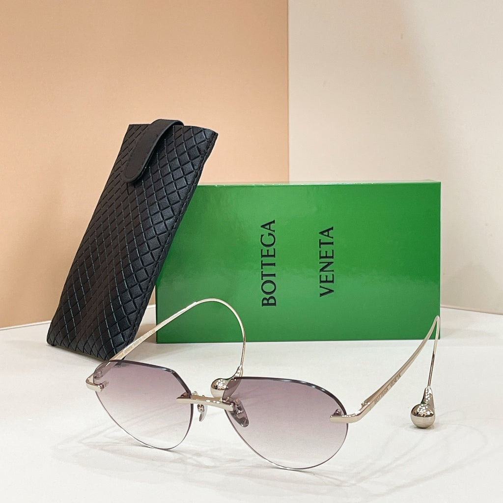 Bottega Veneta aviator sunglasses with gold frame and dark lenses