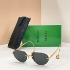 Bottega Veneta aviator sunglasses with gold frame and dark lenses