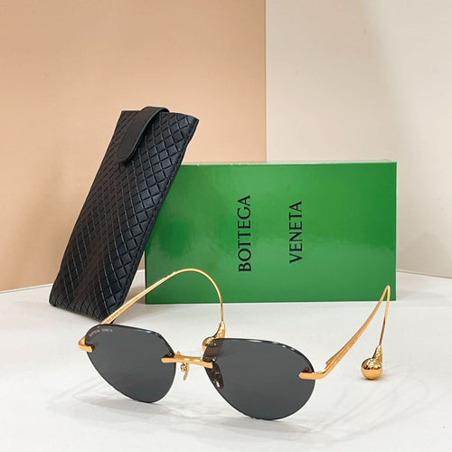 Bottega Veneta aviator sunglasses with gold frame and dark lenses