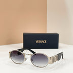 Versace sunglasses with round dark lenses and silver-tone frame