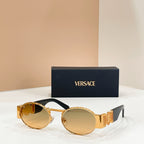 Versace sunglasses with amber lenses, gold-tone frame, black temples