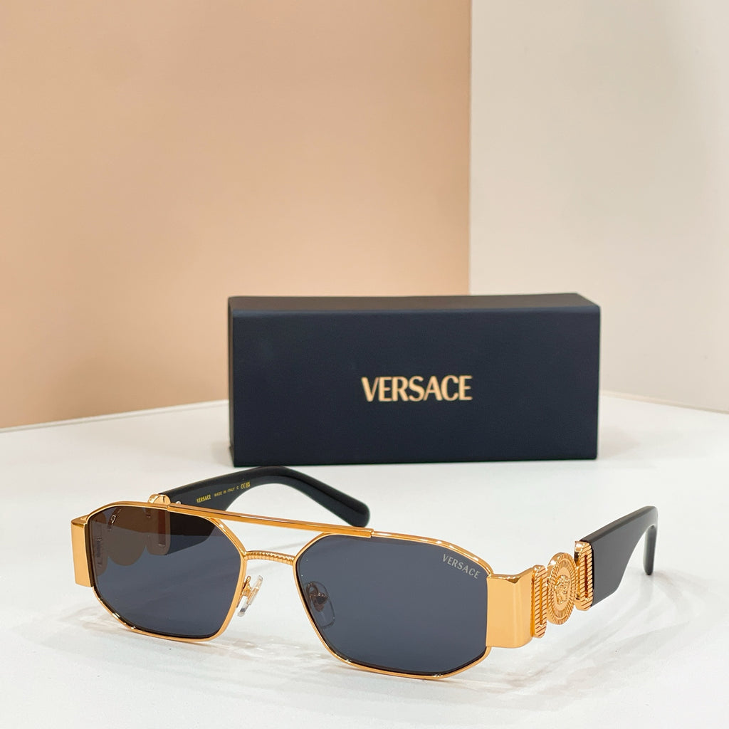Versace sunglasses with dark blue lenses, gold-trim frame, and logo temple details