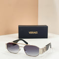 Versace sunglasses with dark lenses, silver frame, and logo temple details