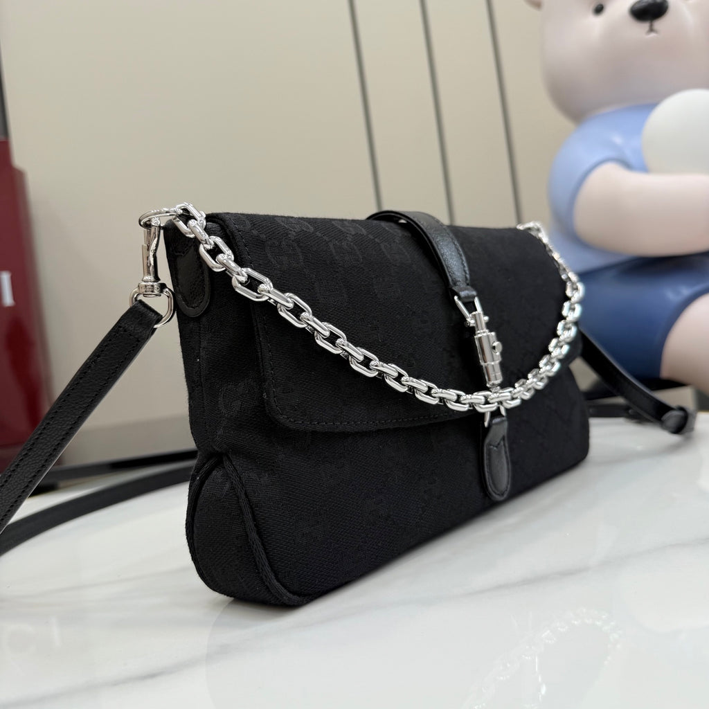 Gucci chain shoulder bag in black jacquard with flap, twist-lock clasp, and shoulder chain