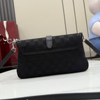 Gucci shoulder bag in black jacquard with front flap, buckle strap, and top chain detail