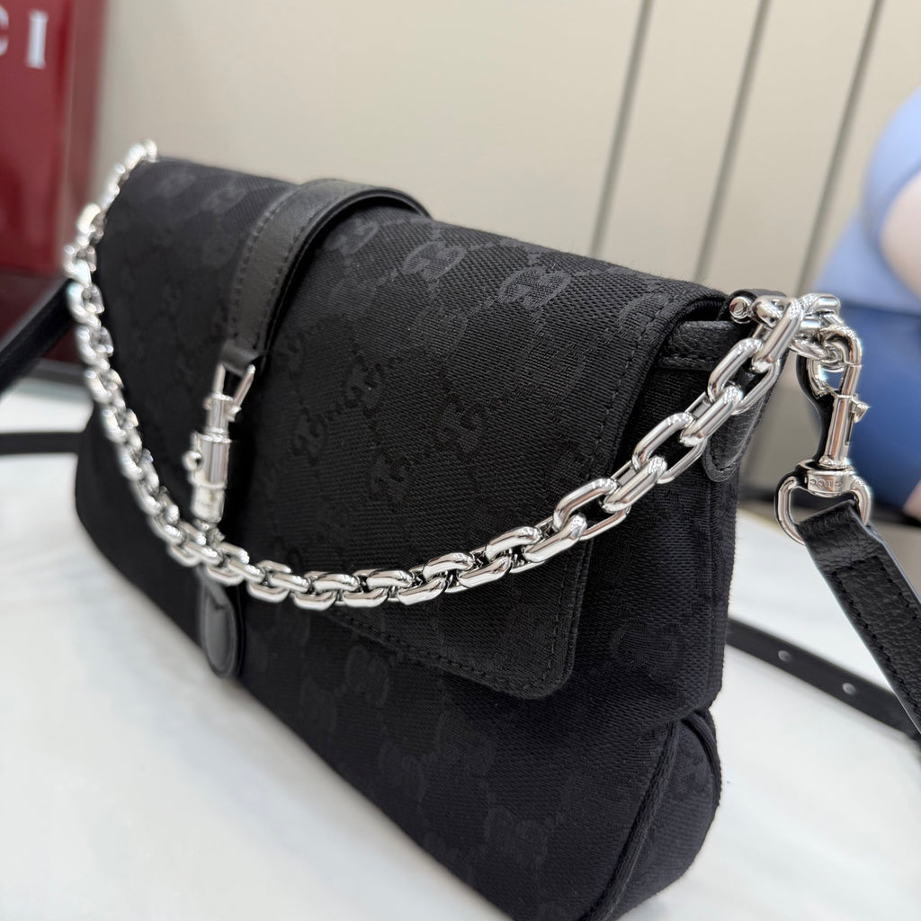 Gucci chain shoulder bag in black jacquard with front flap and metal clasp closure