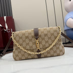 Gucci shoulder bag in beige GG canvas with brown leather trim and gold chain strap