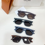 Set of Celine sunglasses with navy and black frames, dark lenses, plus brown case.