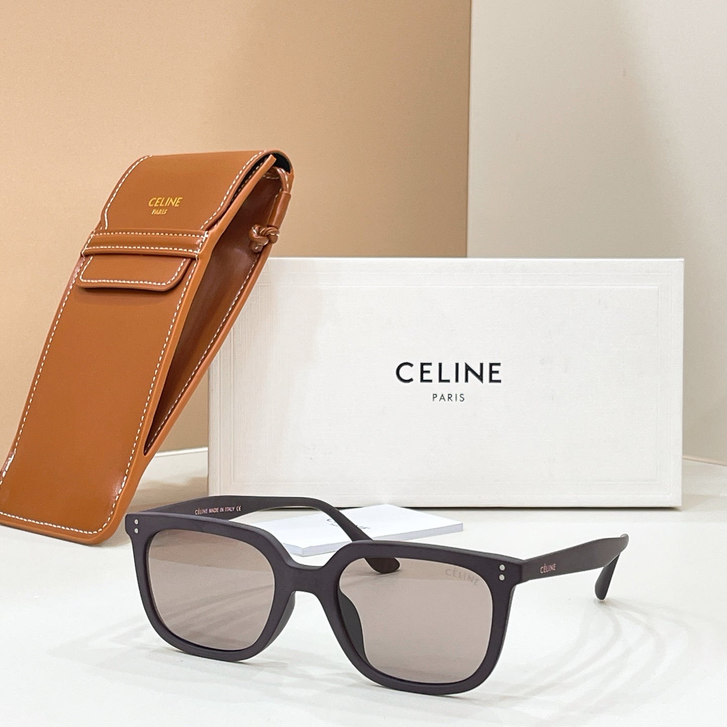 Celine sunglasses with dark frame and smoky gray lenses, front view.
