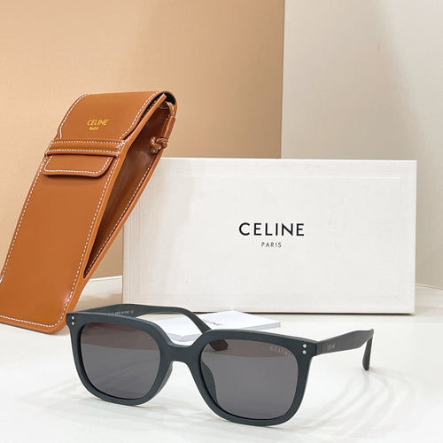Celine sunglasses with dark navy frame and gray lenses, logo on the arms.