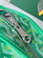 Close-up of green patterned zipper track and silver zipper pull