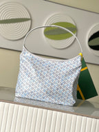 Goyard-pattern hobo bag in light blue and white with top handle and curved sides.