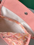 Goyard pink lined interior pocket with printed monogram and metal zipper