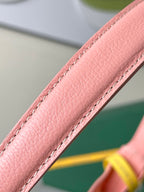 Goyard pink leather strap edge with stitched seam and grained texture