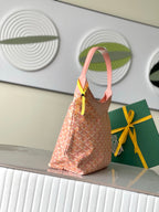 Goyard pink patterned hobo tote bag with top handle and dangling tag