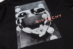 Givenchy black T-shirt front graphic close-up with “GIVENCHY” text
