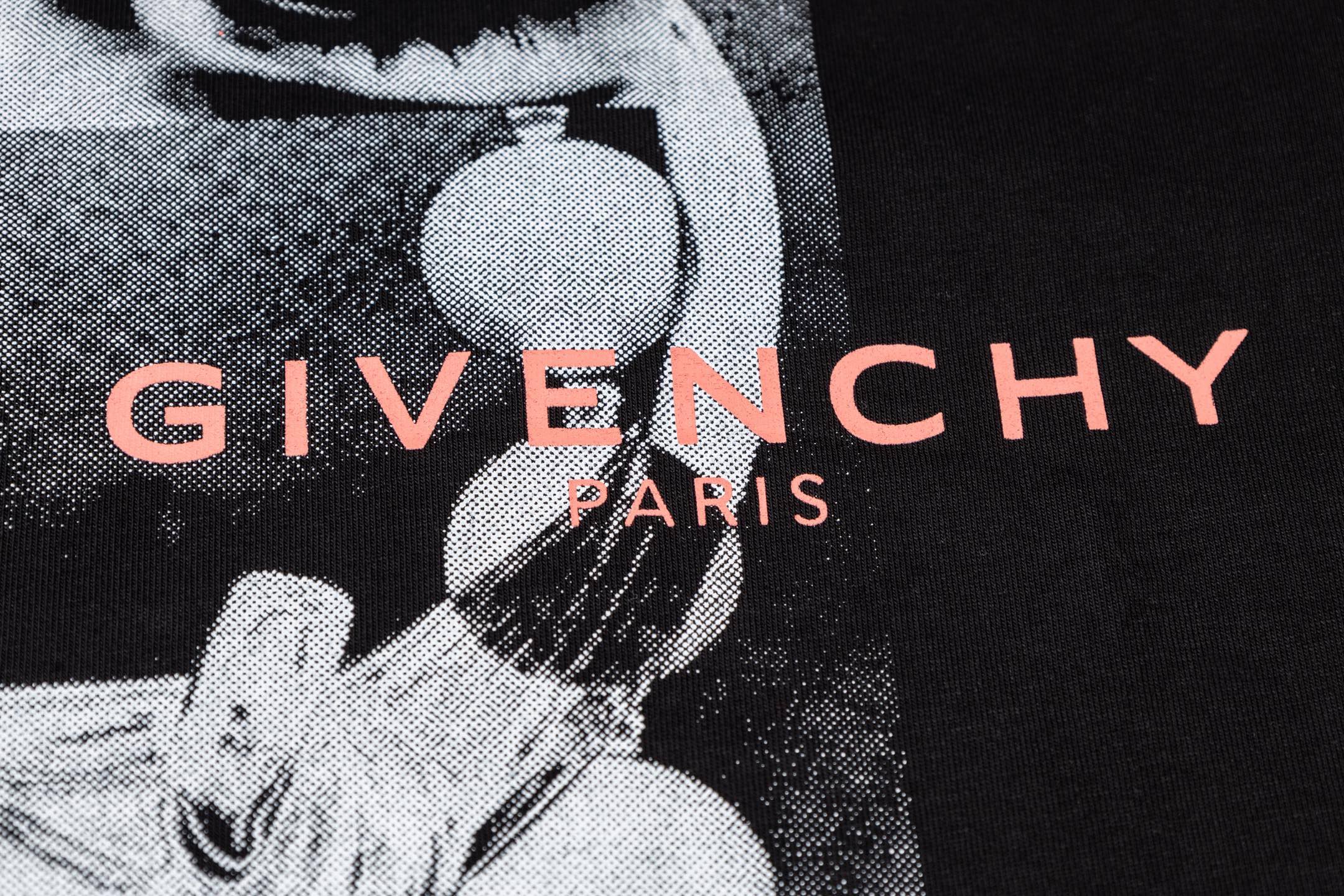 Givenchy T-shirt close-up of red “GIVENCHY PARIS” logo on graphic
