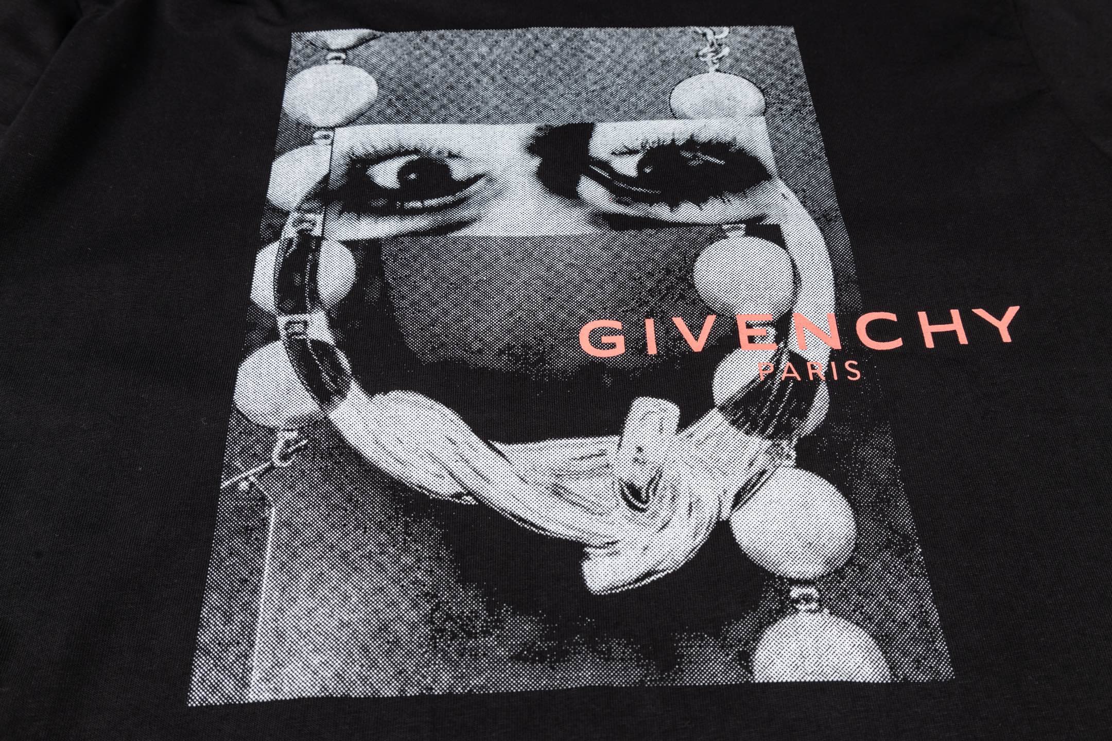 Givenchy black T-shirt with face graphic and red “GIVENCHY PARIS” lettering