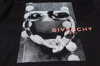 Givenchy black T-shirt graphic close-up with multicolor “GIVENCHY PARIS” logo