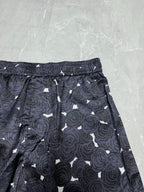 Navy rose-print shorts with elastic waistband and tied drawstring cord detail