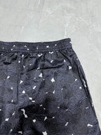 Navy rose-print shorts with elastic waistband and straight side pockets