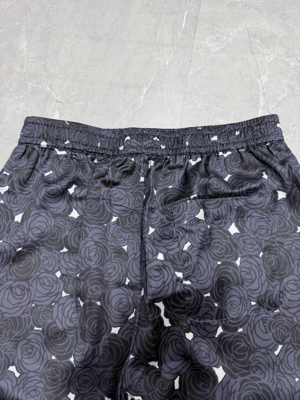 Navy rose-pattern shorts with elastic waist and adjustable drawstring