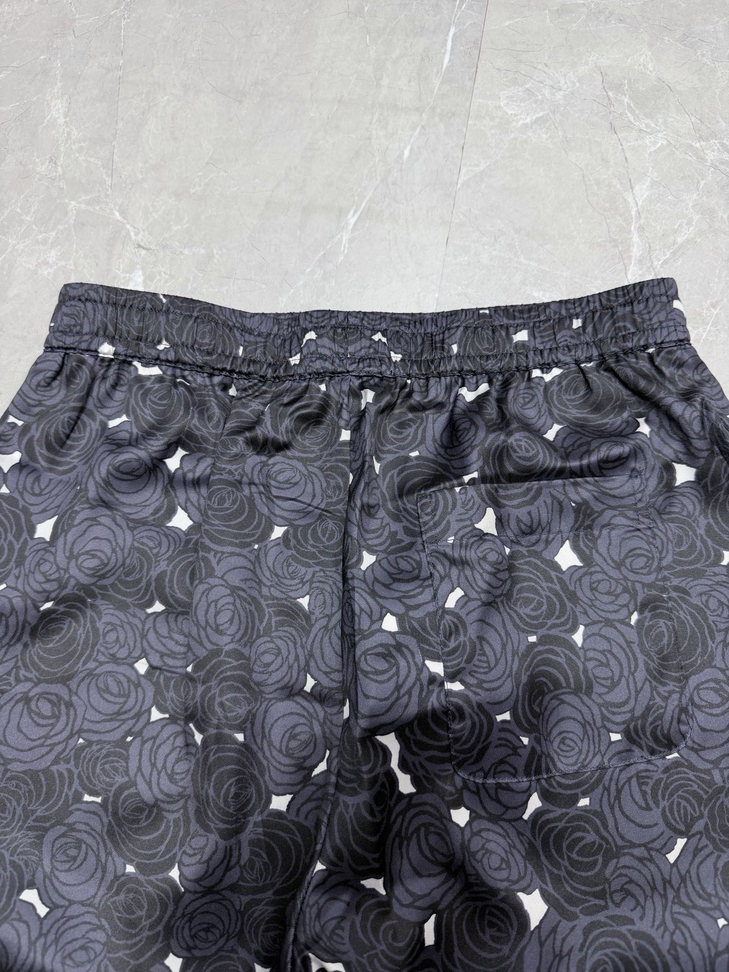 Navy rose-pattern shorts with elastic waist and adjustable drawstring