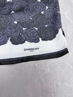 Givenchy "GIVENCHY PARIS" label on dark rose-pattern shirt hem with black trim
