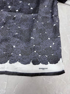 Givenchy shirt hem with rose pattern and "GIVENCHY" label