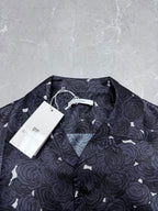 Givenchy short-sleeve shirt with dark rose pattern, pointed collar and button placket