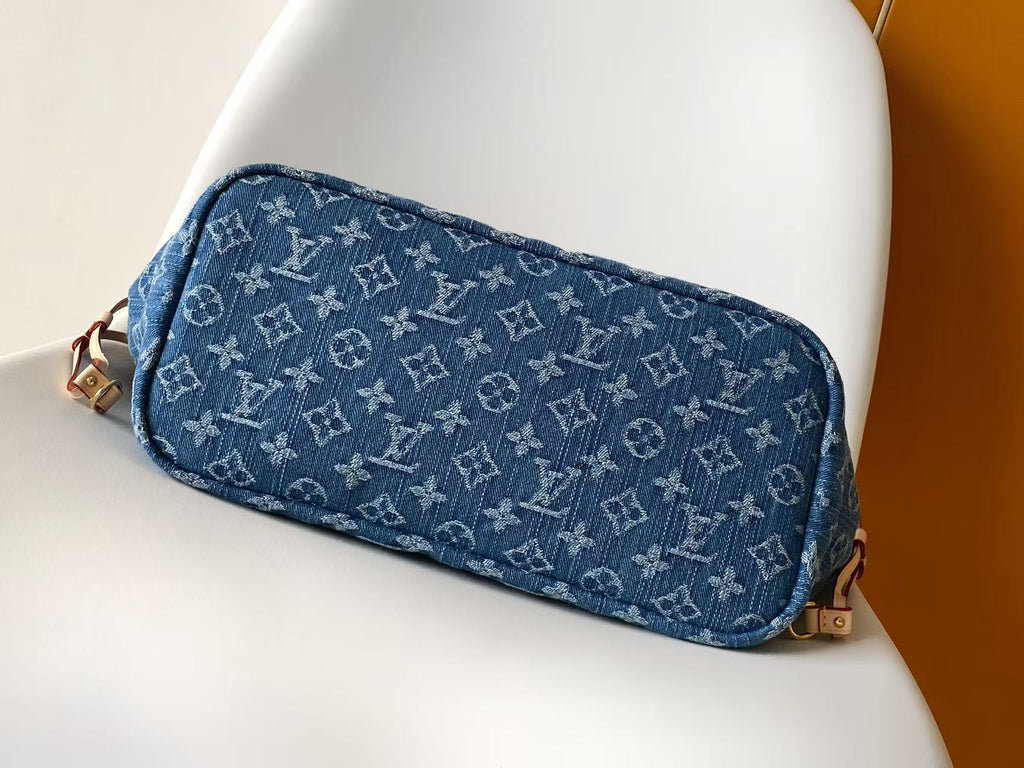 Louis Vuitton blue monogram zip pouch-style bag with tan zipper and trim