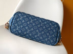 Louis Vuitton blue monogram zip pouch-style bag with tan zipper and trim