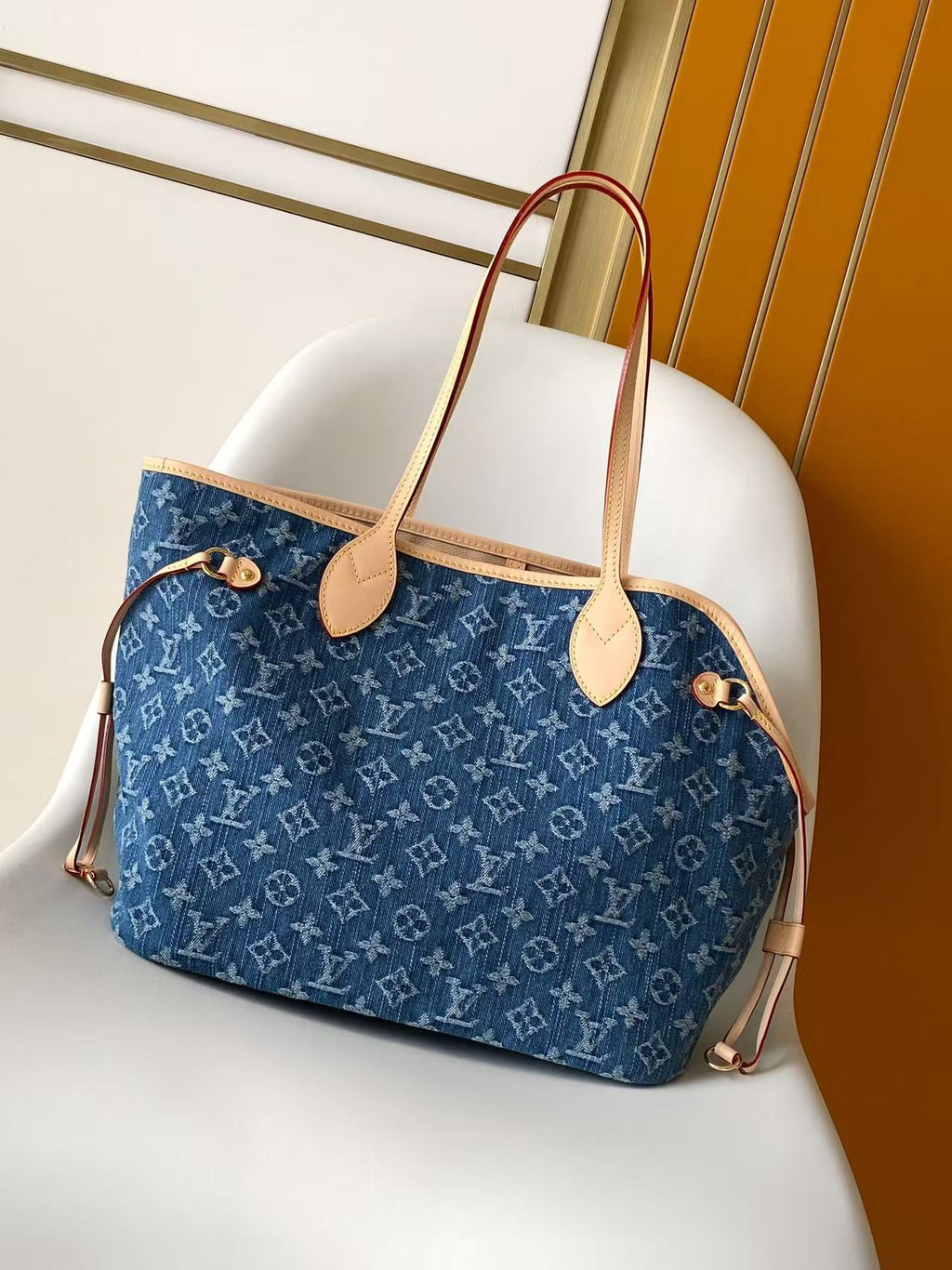 Louis Vuitton monogram tote bag with tan trim and two top handles in blue