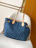 Louis Vuitton monogram tote bag with tan trim and two top handles in blue