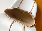 Louis Vuitton monogram tote bag open top view showing tan interior and clasp