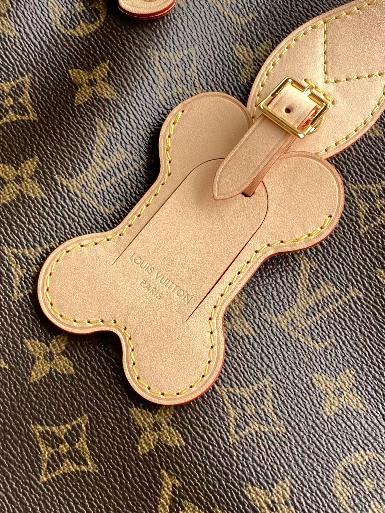 Louis Vuitton monogram tote bag bone-shaped leather charm with gold buckle