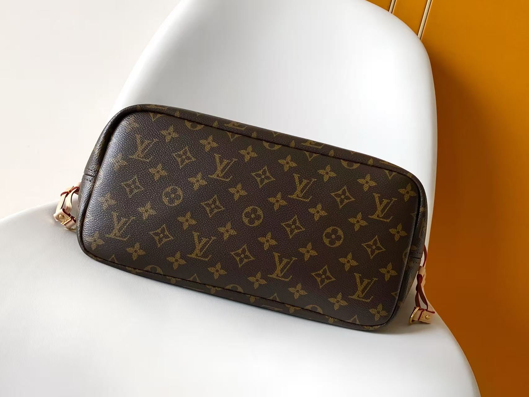 Louis Vuitton monogram crossbody bag with zipper top and tan edging