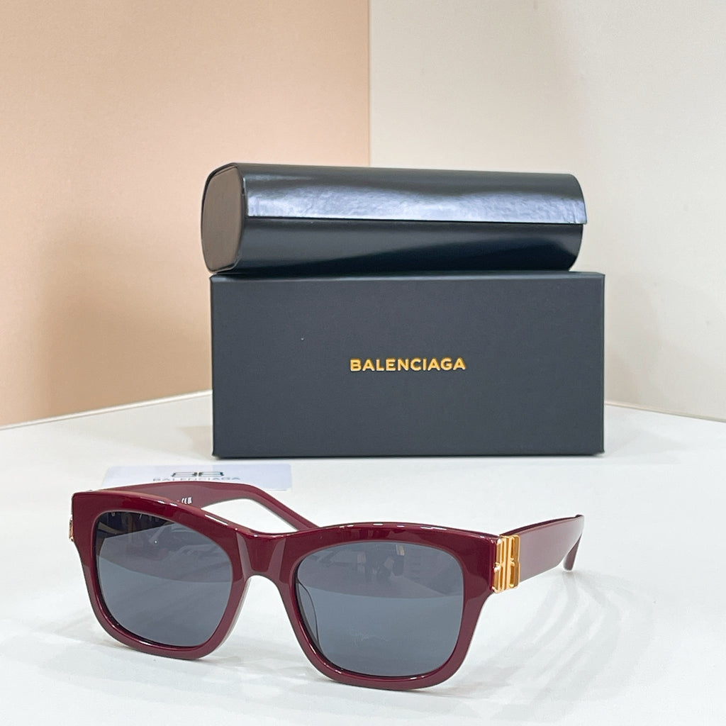 Red square sunglasses with gold logo temple detail and tinted lenses