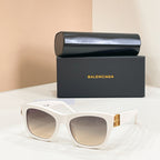 White square sunglasses with gold logo temple detail and light-tinted lenses