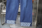 Louis Vuitton blue denim wide-leg pants with logo-pattern cuffs at the hem