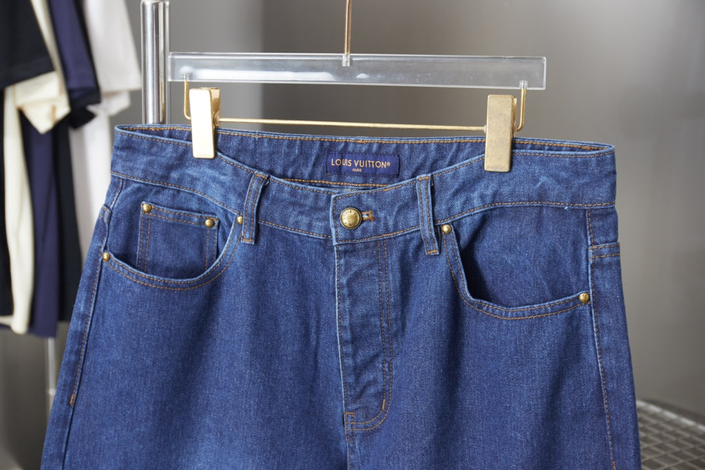 Louis Vuitton blue denim pants with front pockets and "LOUIS VUITTON" waistband label