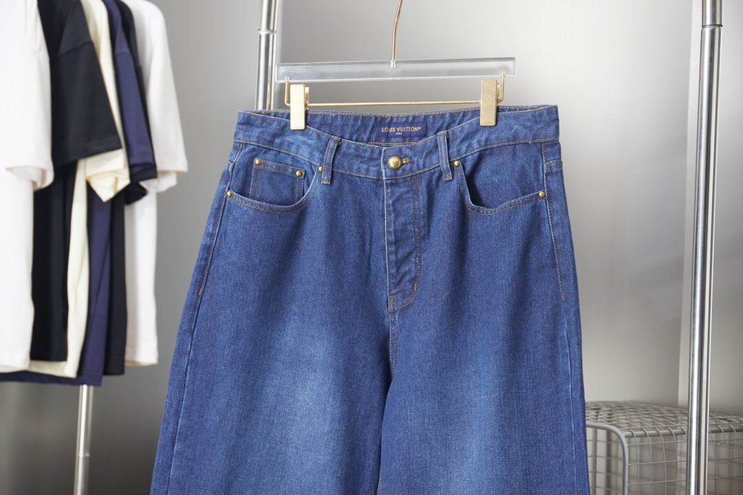 Louis Vuitton blue denim pants with belt loops and front pockets, medium wash