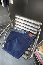 Louis Vuitton blue denim pants with logo-pattern cuff trim and front pockets