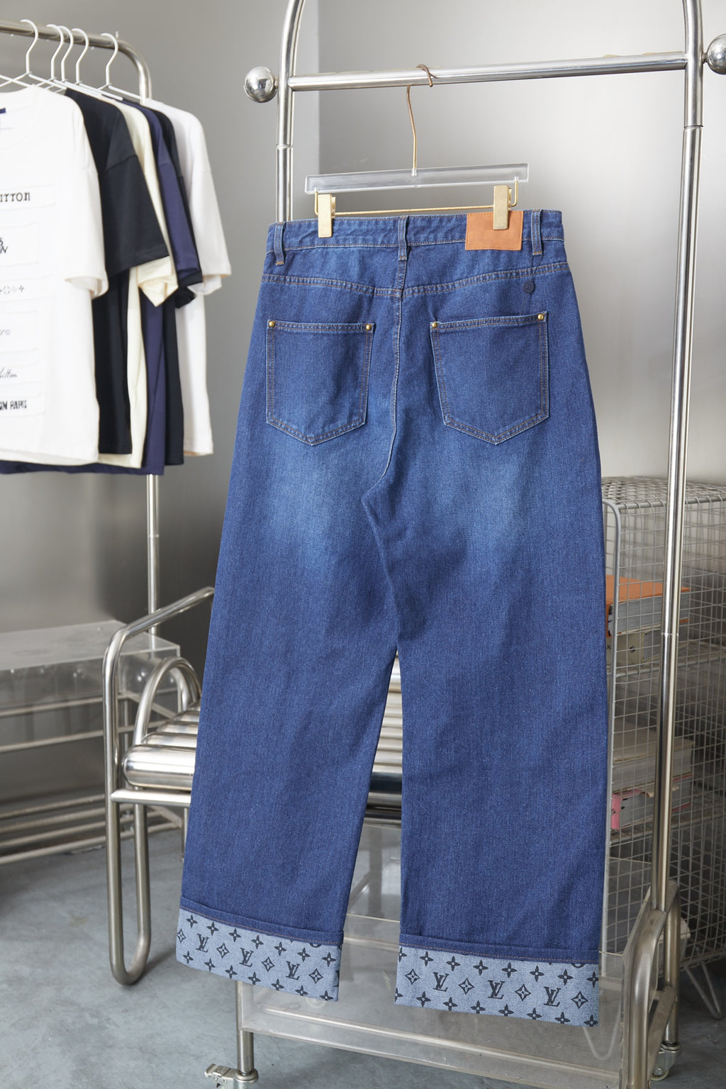 Louis Vuitton blue denim wide-leg pants, back patch pockets, logo-pattern hem panels