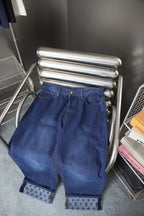 Louis Vuitton blue denim wide-leg pants with cuff logo-pattern trim