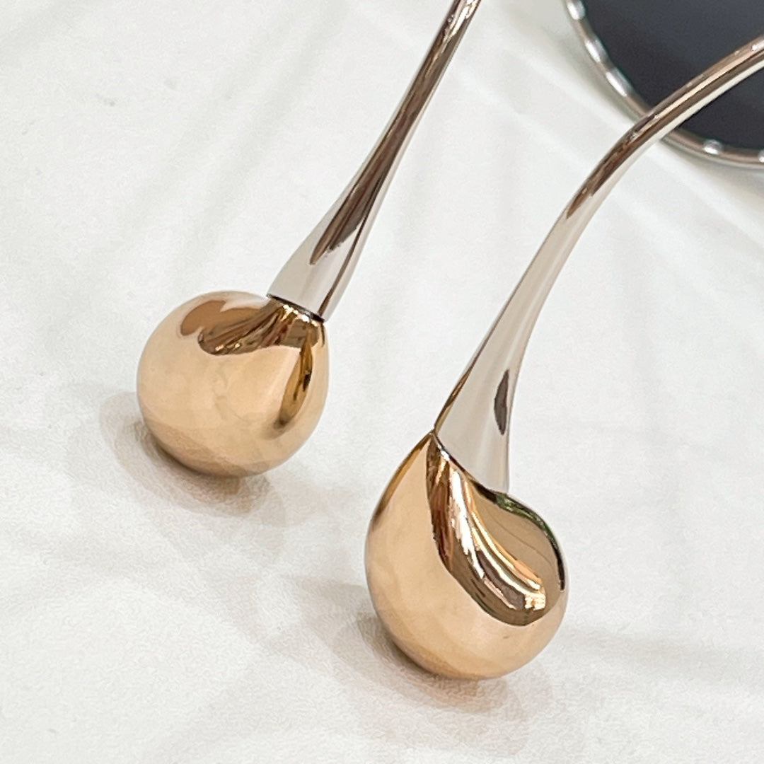 Aviator sunglasses close-up of gold-tone lens frame and round end studs