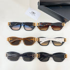 Multiple cat-eye sunglasses laid out with gold-tone B logos in black and tortoise frames
